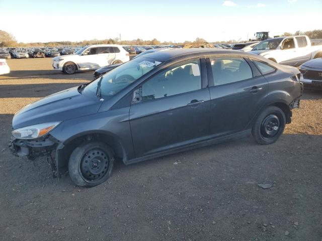 FORD FOCUS SE 2018 with VIN 1FADP3F21JL285417 - Photo from auction