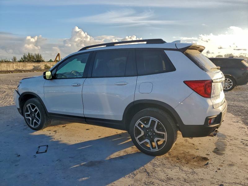 Photo 2 from auction – 2023 HONDA PASSPORT E with VIN 5FNYF8H09PB012549