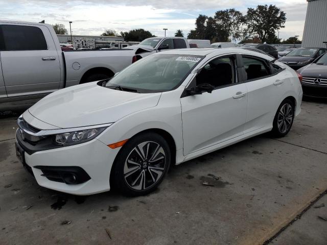 HONDA CIVIC EX 2018 with VIN JHMFC1F37JX039054 - Photo from auction