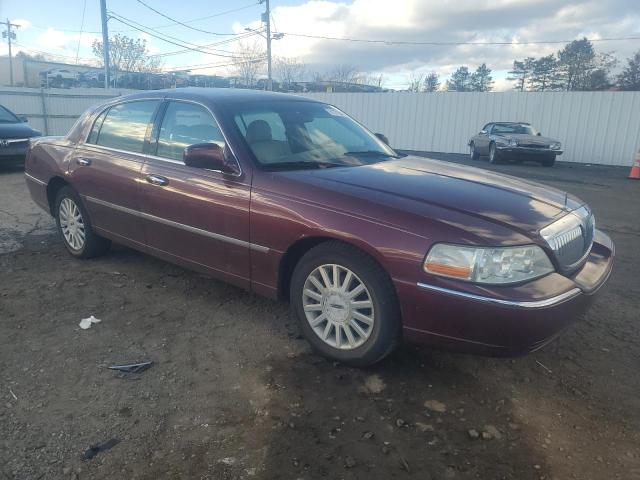 Photo 4 from auction – 2004 LINCOLN TOWN CAR E with VIN 1LNHM81W04Y662172