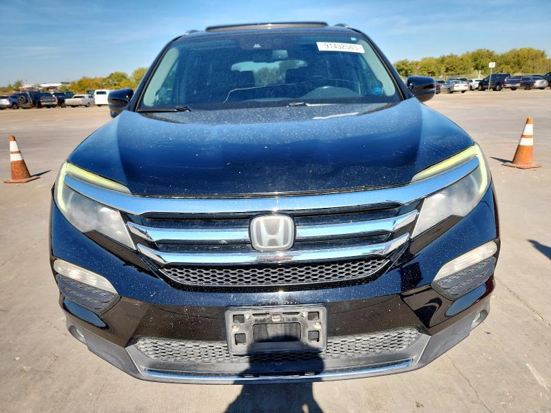 Photo 5 from auction – 2016 HONDA PILOT TOUR with VIN 5FNYF6H92GB068383