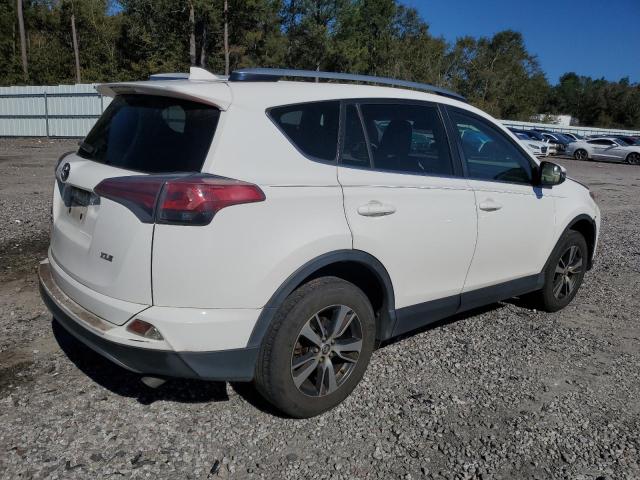 Photo 3 from auction – 2017 TOYOTA RAV4 XLE with VIN JTMWFREV7HJ702274