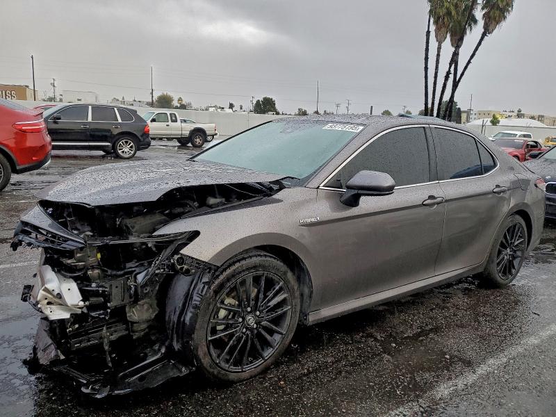 TOYOTA CAMRY LE 2021 with VIN 4T1C31AK2MU559330 - Photo from auction