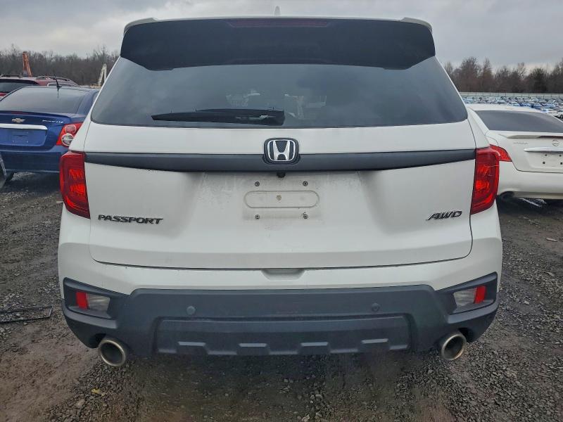 Photo 6 from auction – 2023 HONDA PASSPORT E with VIN 5FNYF8H53PB038253