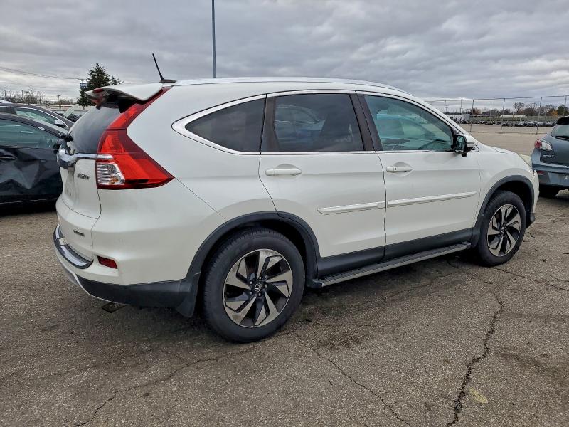 Photo 3 from auction – 2015 HONDA CR-V TOURI with VIN 5J6RM4H94FL076716