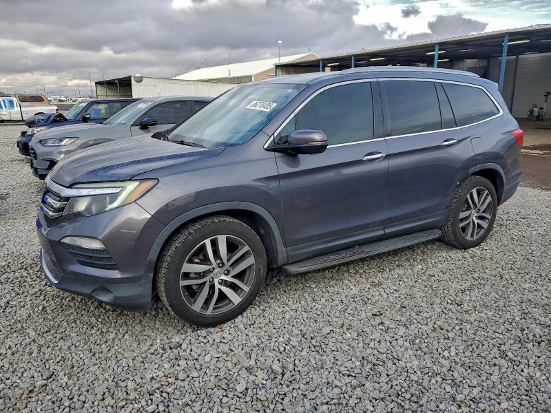 HONDA PILOT TOUR 2016 with VIN 5FNYF5H91GB039211 - Photo from auction