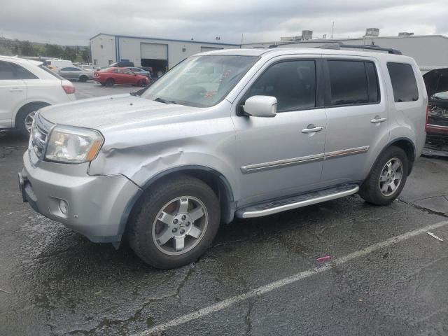 HONDA PILOT TOUR 2010 with VIN 5FNYF4H92AB036531 - Photo from auction