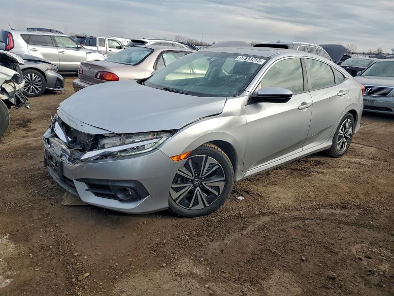 Photo 1 from auction – 2018 HONDA CIVIC EX with VIN JHMFC1F38JX002336