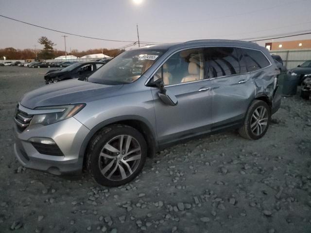 HONDA PILOT TOUR 2017 with VIN 5FNYF6H92HB022697 - Photo from auction