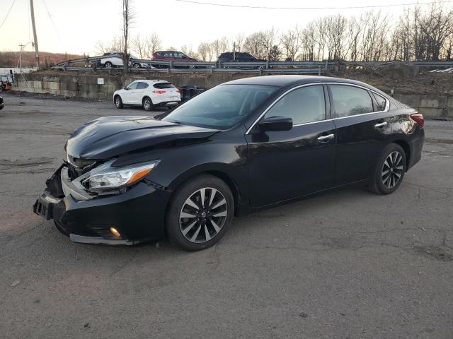 NISSAN ALTIMA 2.5 2018 with VIN 1N4AL3AP0JC143593 - Photo from auction