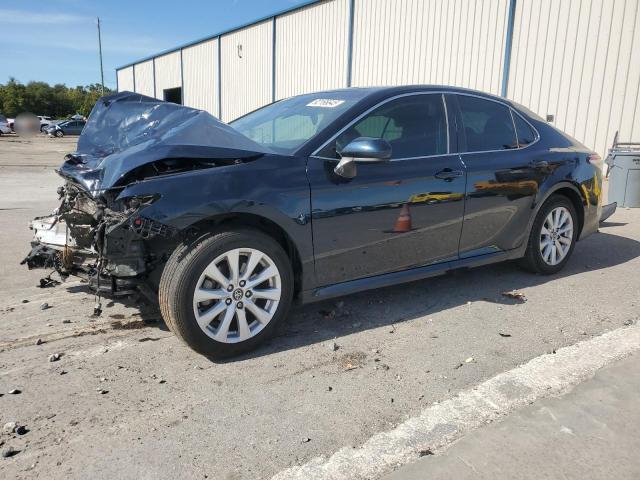 TOYOTA CAMRY LE 2020 with VIN 4T1C11AK2LU869739 - Photo from auction