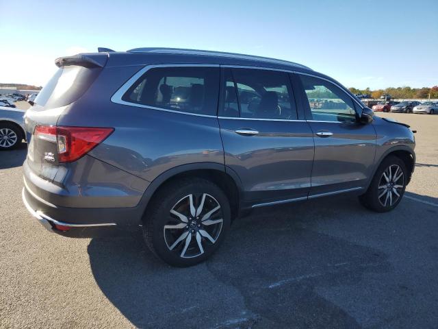Photo 3 from auction – 2022 HONDA PILOT ELIT with VIN 5FNYF6H01NB052836