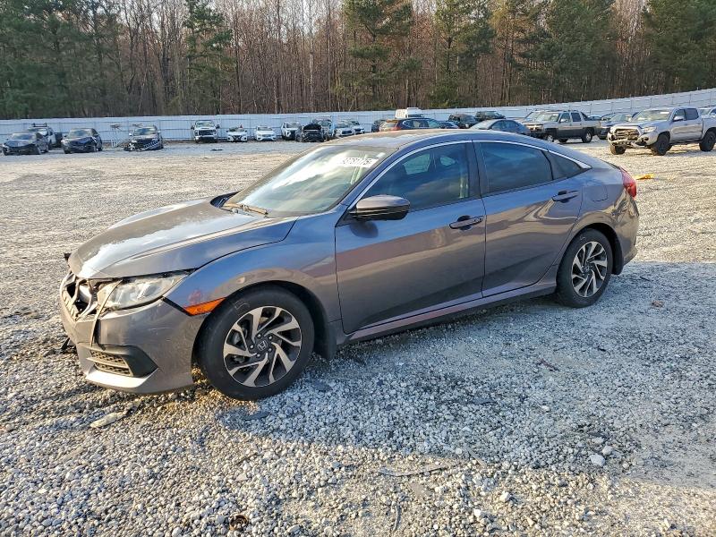HONDA CIVIC EX 2017 with VIN 19XFC2F74HE077698 - Photo from auction