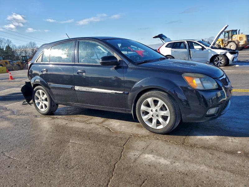 Photo 4 from auction – 2011 KIA RIO BASE with VIN KNADH5A39B6767715