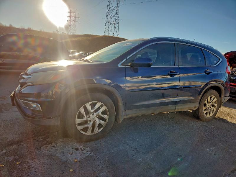 HONDA CR-V 2015 with VIN 2HKRM4H75FH664147 - Photo from auction