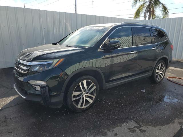 HONDA PILOT TOUR 2018 with VIN 5FNYF5H92JB032033 - Photo from auction