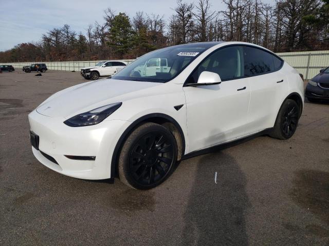 TESLA MODEL Y 2023 with VIN 7SAYGDEE1PF827997 - Photo from auction