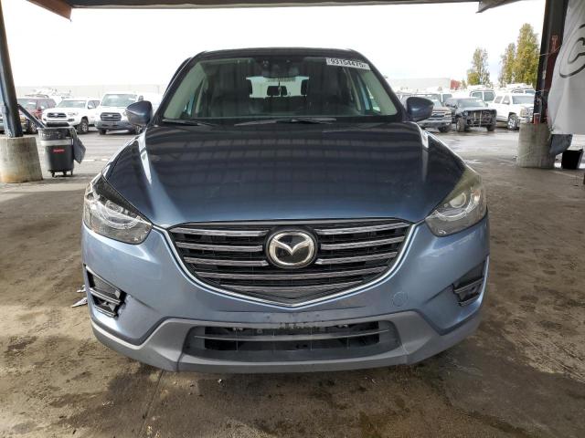 Photo 5 from auction – 2016 MAZDA CX-5 GT with VIN JM3KE2DY1G0658045