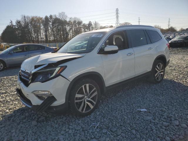 HONDA PILOT TOUR 2017 with VIN 5FNYF6H94HB102924 - Photo from auction