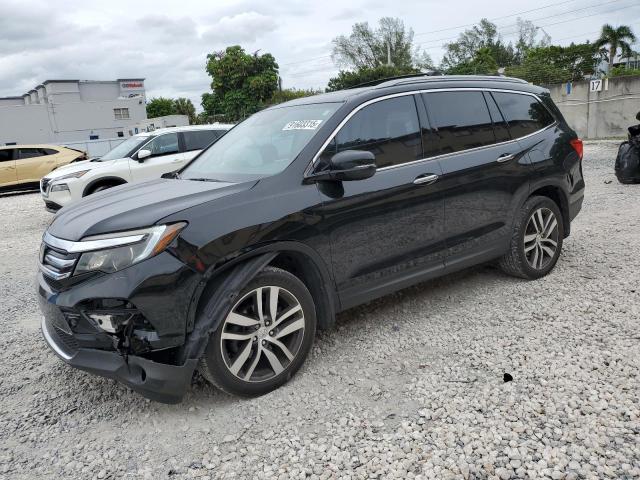 Photo 1 from auction – 2016 HONDA PILOT TOUR with VIN 5FNYF5H98GB006609