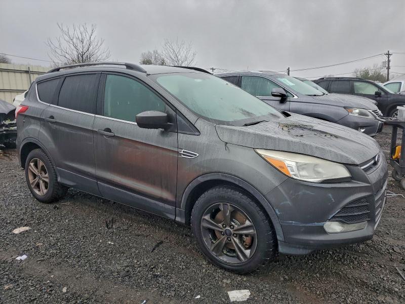Photo 4 from auction – 2015 FORD ESCAPE with VIN 1FMCU9GX5FUA00033