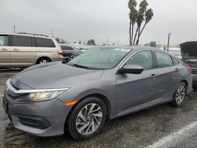 Photo 1 from auction – 2018 HONDA CIVIC EX with VIN 19XFC2F73JE204978