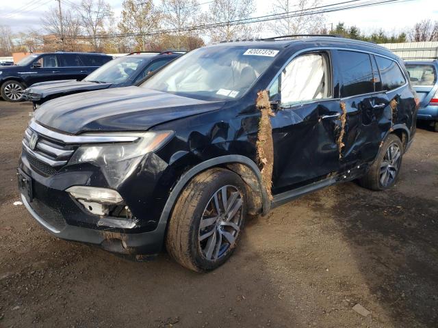 HONDA PILOT TOUR 2016 with VIN 5FNYF6H94GB097187 - Photo from auction