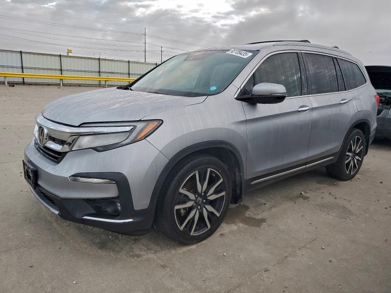 HONDA PILOT TOUR 2020 with VIN 5FNYF5H98LB021380 - Photo from auction