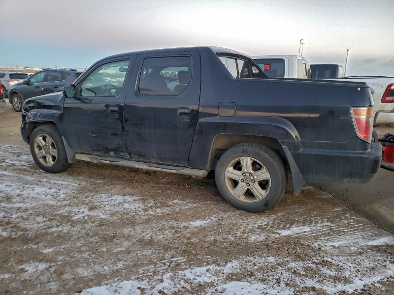 Photo 2 from auction – 2010 HONDA RIDGELINE with VIN 5FPYK1F59AB504028