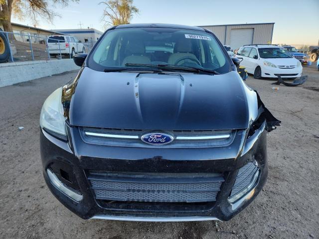 Photo 5 from auction – 2016 FORD ESCAPE SE with VIN 1FMCU9G99GUC79604