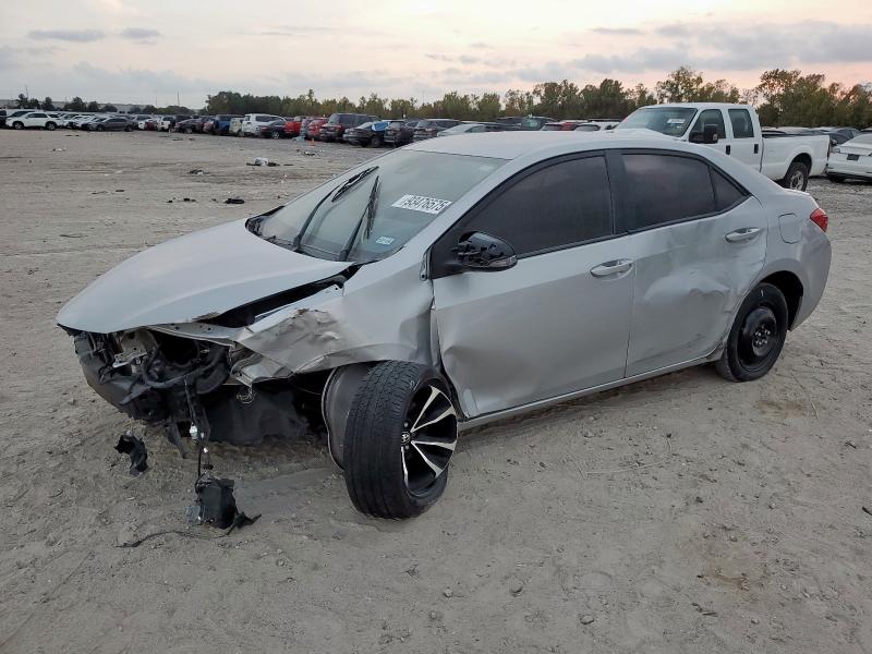 TOYOTA COROLLA L 2018 with VIN 5YFBURHE3JP779211 - Photo from auction