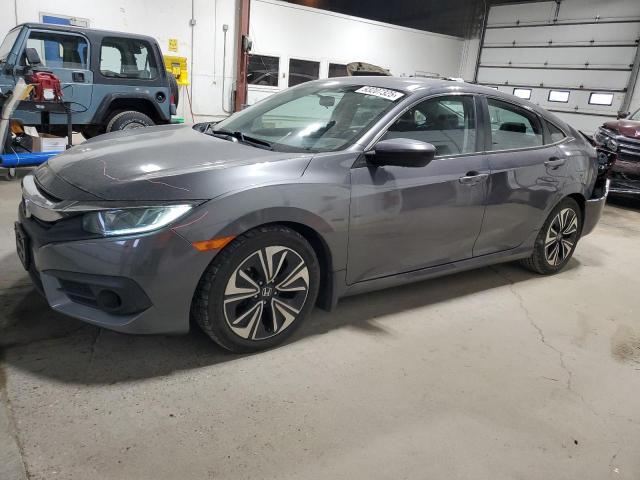 HONDA CIVIC EX 2018 with VIN 2HGFC1F37JH640004 - Photo from auction