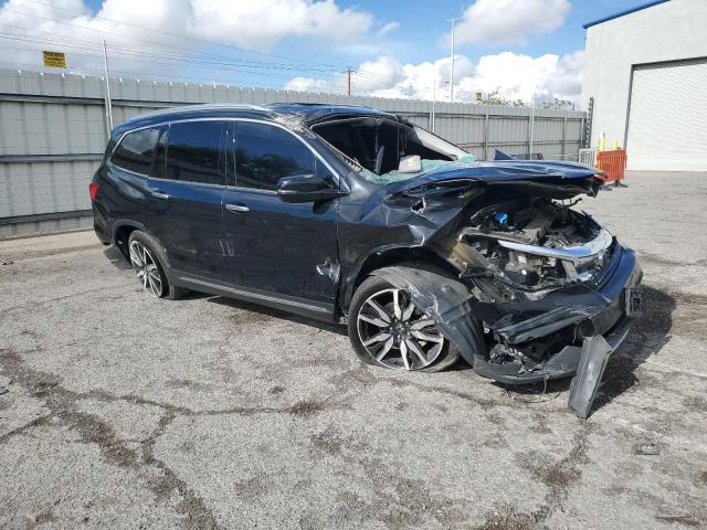 Photo 4 from auction – 2021 HONDA PILOT TOUR with VIN 5FNYF5H65MB038435