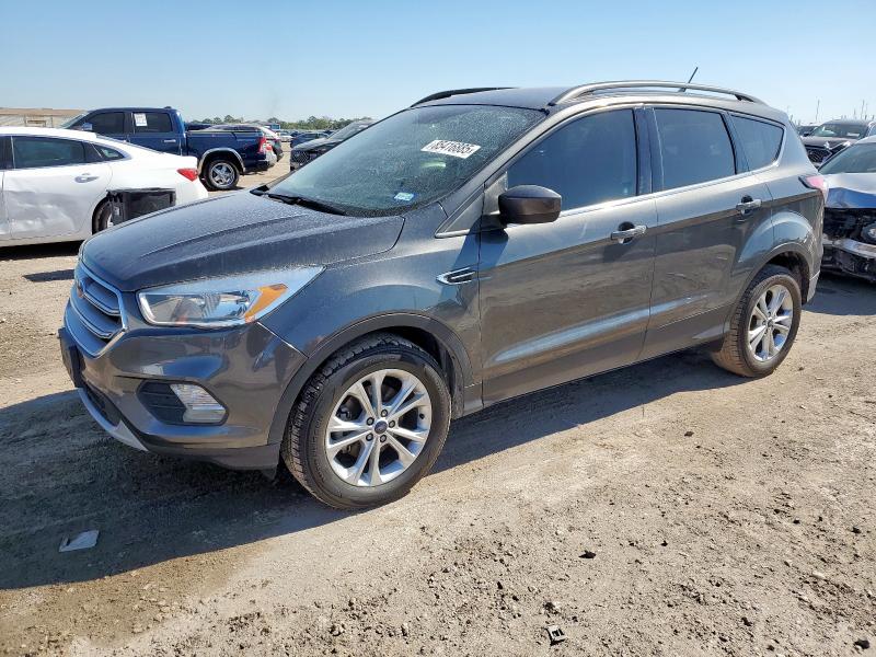 FORD ESCAPE SE 2018 with VIN 1FMCU0GD7JUA83975 - Photo from auction