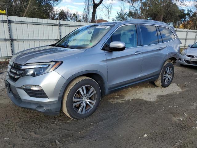 HONDA PILOT EXLN 2018 with VIN 5FNYF6H79JB005111 - Photo from auction