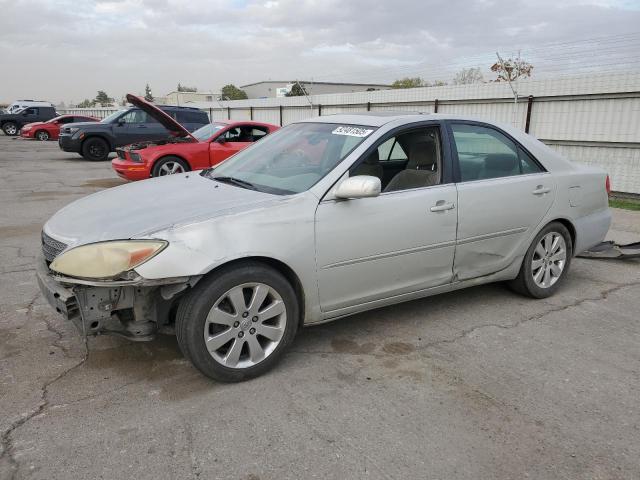 TOYOTA CAMRY LE 2003 with VIN 4T1BF32K03U558043 - Photo from auction