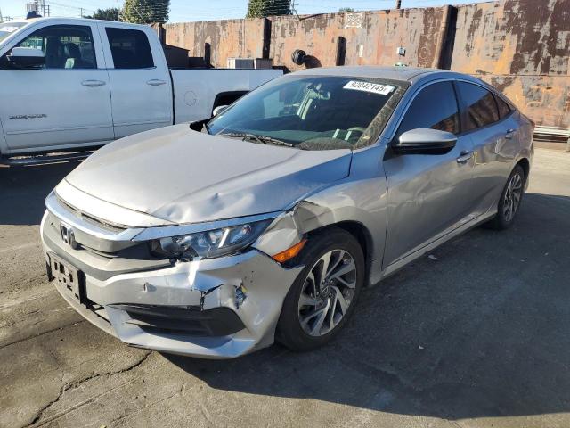 HONDA CIVIC EX 2018 with VIN 2HGFC2F74JH564721 - Photo from auction