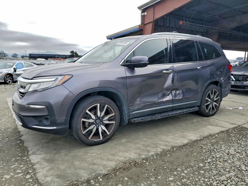 HONDA PILOT TOUR 2019 with VIN 5FNYF5H92KB008252 - Photo from auction