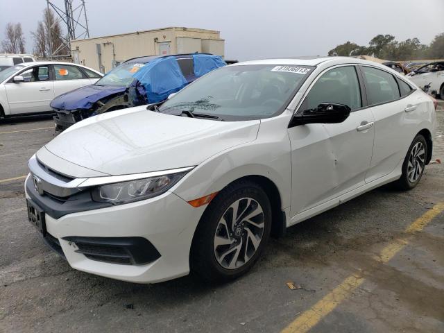HONDA CIVIC EX 2018 with VIN 19XFC2F72JE037576 - Photo from auction