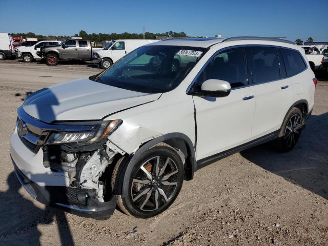 HONDA PILOT TOUR 2020 with VIN 5FNYF5H62LB011952 - Photo from auction