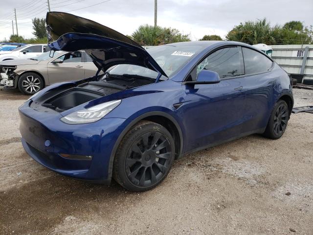 TESLA MODEL Y 2023 with VIN 7SAYGAEE9PF607117 - Photo from auction