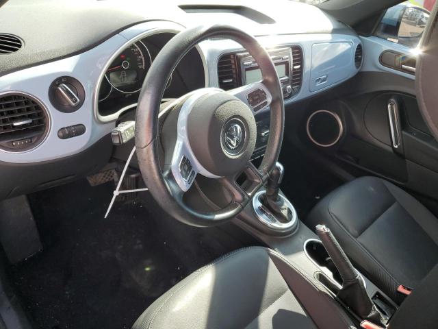 Photo 8 from auction – 2014 VOLKSWAGEN BEETLE with VIN 3VWJX7AT3EM614530