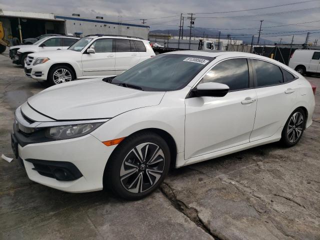 HONDA CIVIC EX 2018 with VIN 2HGFC1F33JH641098 - Photo from auction
