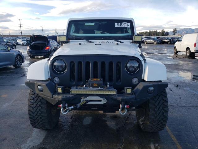 Photo 5 from auction – 2014 JEEP WRANGLER U with VIN 1C4BJWFG9EL115716