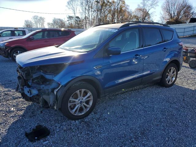 FORD ESCAPE SE 2018 with VIN 1FMCU9GD1JUB05702 - Photo from auction