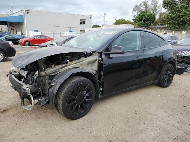 TESLA MODEL Y 2022 con VIN 7SAYGAEE6NF335851 - Foto de la subasta