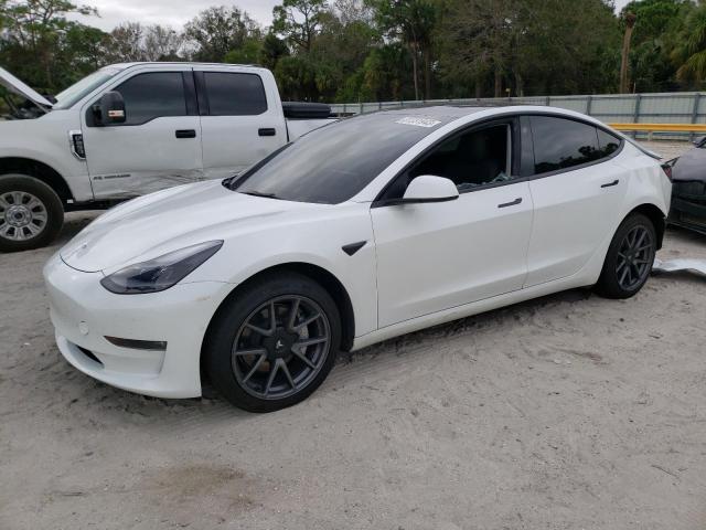 TESLA MODEL 3 2022 with VIN 5YJ3E1EB9NF125988 - Photo from auction