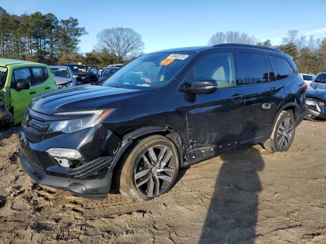 HONDA PILOT TOUR 2016 with VIN 5FNYF6H9XGB030304 - Photo from auction
