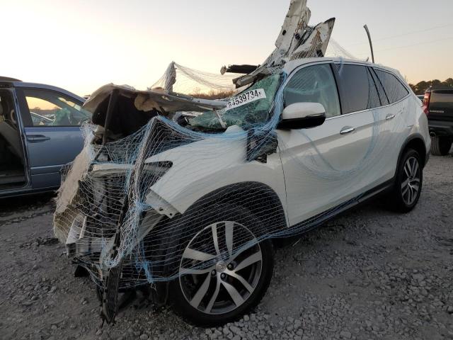 HONDA PILOT TOUR 2017 with VIN 5FNYF5H98HB029678 - Photo from auction