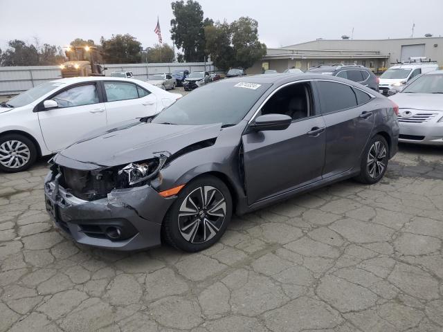 HONDA CIVIC EXL 2018 with VIN JHMFC1F76JX041963 - Photo from auction